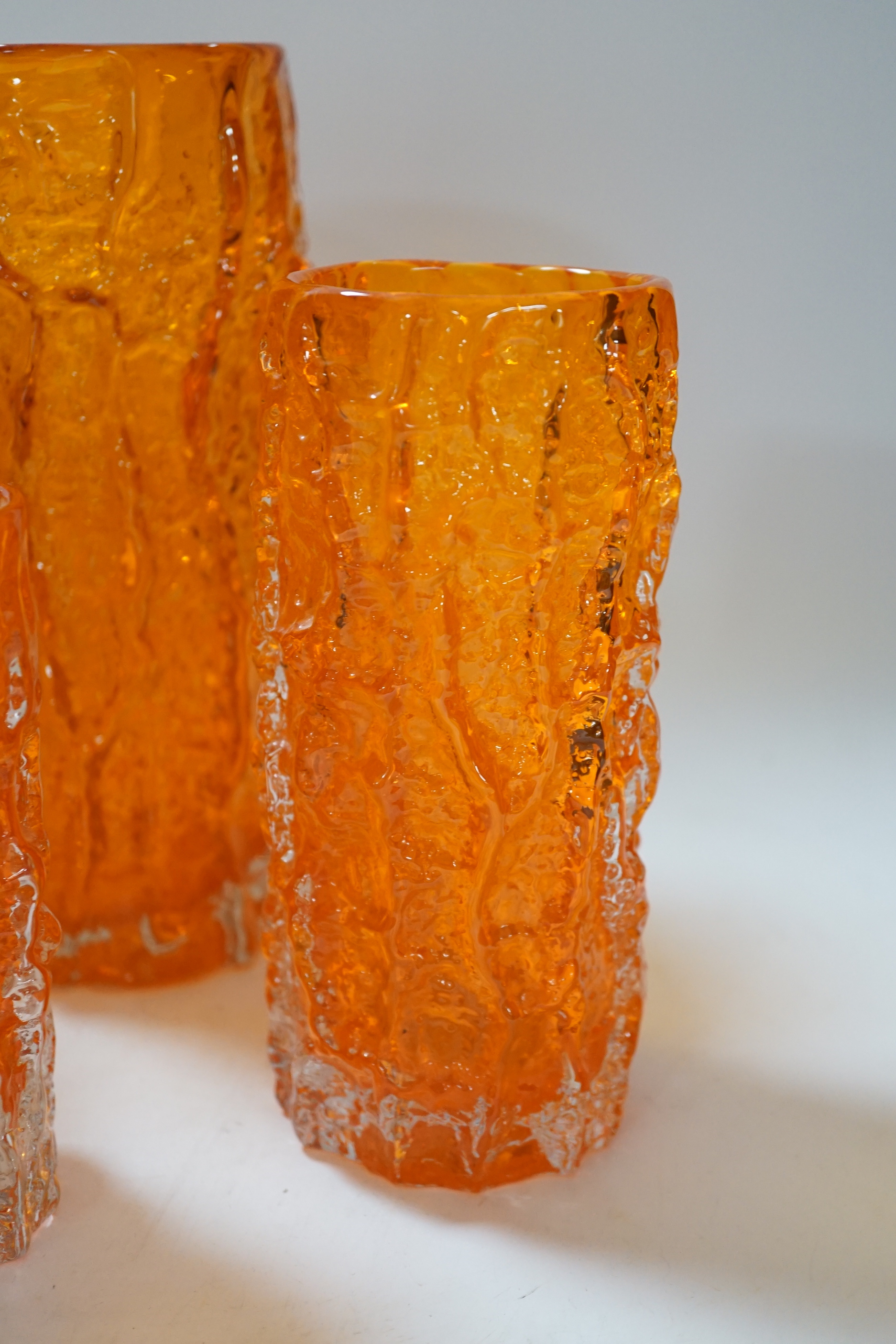 A pair and two other Whitefriars ‘bark’ vases in tangerine, tallest 24cm